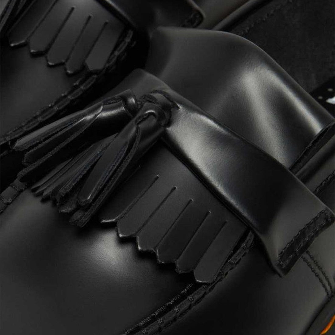 Close-up of Dr Martens Adrian Bex Black Smooth Platform Loafer Shoes, featuring a decorative fringe and tassel on the upper and a durable Goodyear-welted platform sole., 183681, 190665420241, 190665420166, 190665420173, 190665420180, 190665420197, 1906654