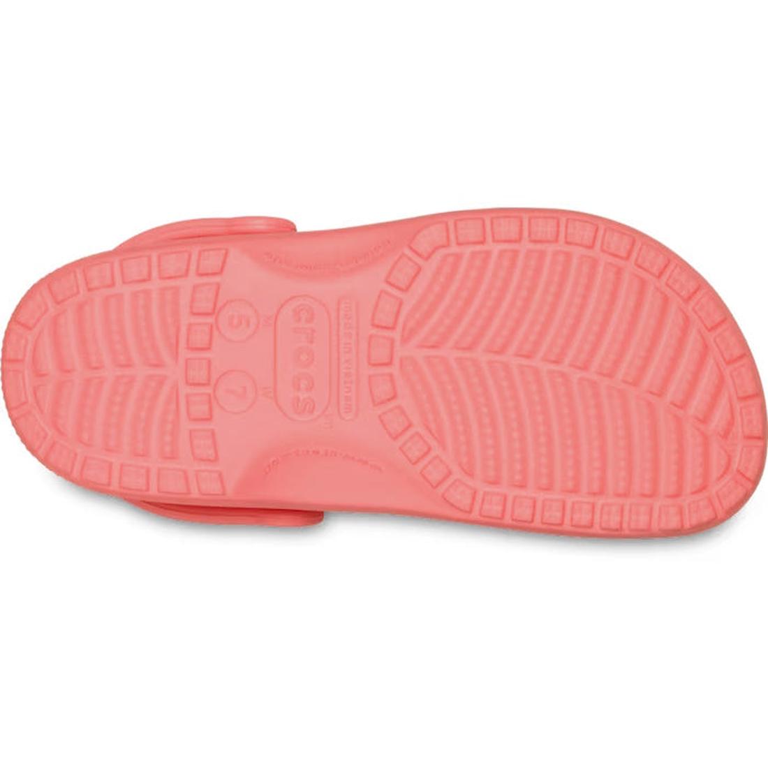 The image shows the sole of the Crocs - Classic Clog Adults Guava Pink Orange, highlighting its textured tread pattern and size markings that represent signature Crocs comfort., 49797, 49798, 49799, 49800, 49801, 49802, 49803, 49804, 49805, 49797, 1984453