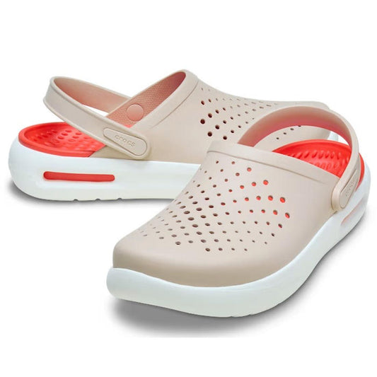The Crocs In Motion Clog Quartz Browny Pink features beige clogs with quartz pink footbeds, white soles, perforated uppers, and adjustable heel straps for a Free Feel Technology experience.