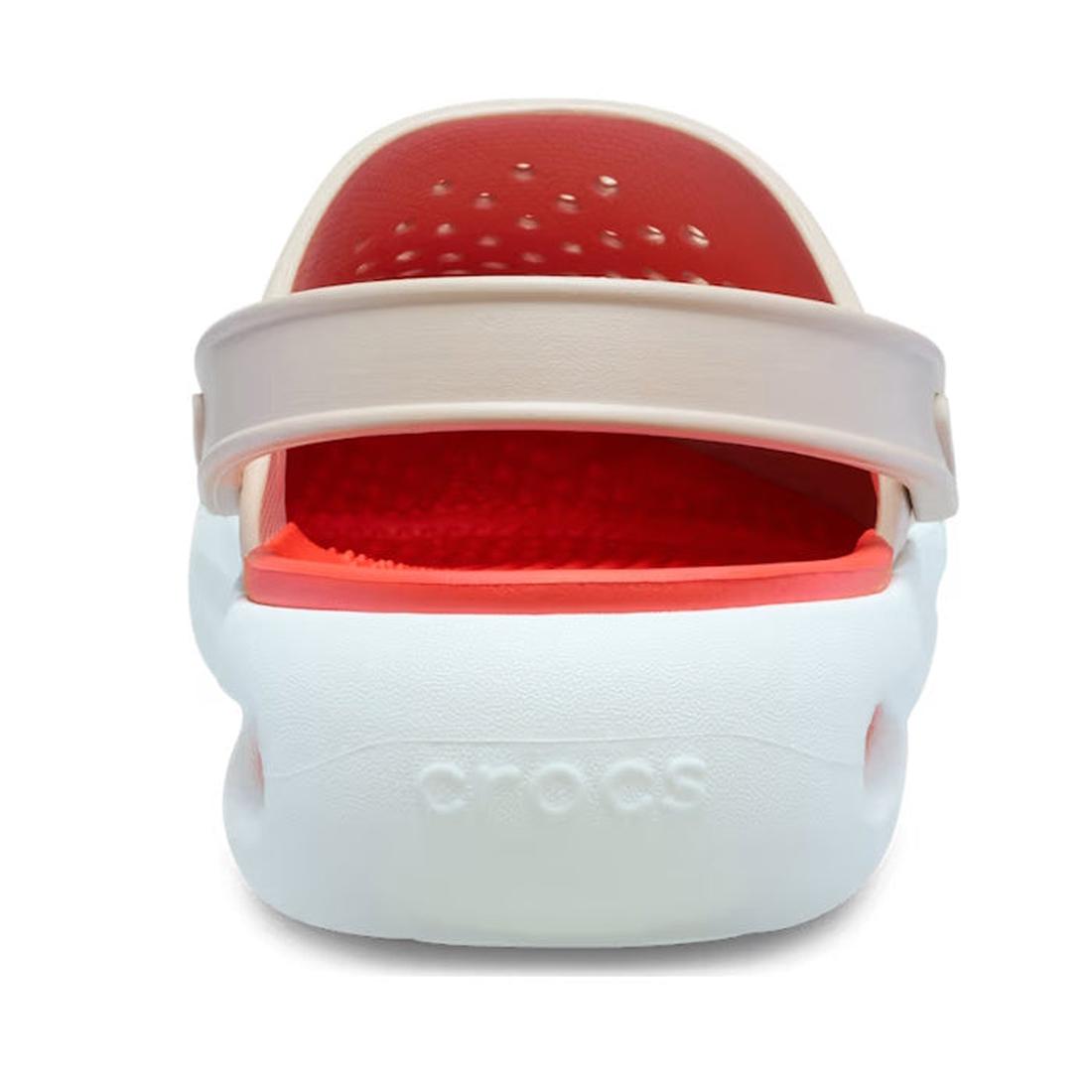A rear view of the Crocs In Motion Clog in Quartz Browny Pink shows its beige adjustable heel strap, ventilation holes on the insole, and "crocs" embossed on the heel, highlighting comfort with Free Feel Technology., 49764, 49765, 49766, 49767, 49768, 497