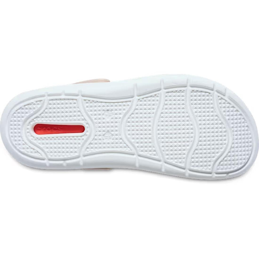 The image displays the white rubber outsole of the Crocs In Motion Clog Quartz Browny Pink, featuring textured grip patterns and curved grooves. Near the heel, a small red rectangle with Free Feel Technology is visible., 49764, 49765, 49766, 49767, 49768,
