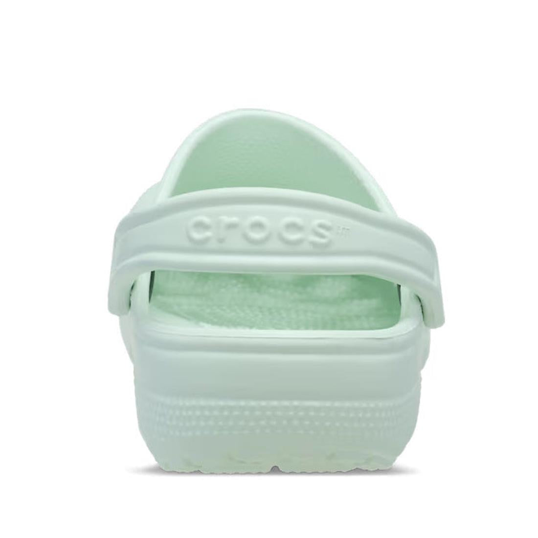 heel view Mint green sandal with 'Crocs' branding on the back strap on a white background,
198445189661,
198445189678,
198445189685,
198445189692,
198445189708,
198445189715,
198445189609,, 198445189661, 198445189678, 198445189685, 198445189692, 198445189
