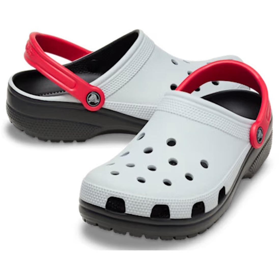 a pair of grey adults crocs clogs with red straps and black sole on a white background