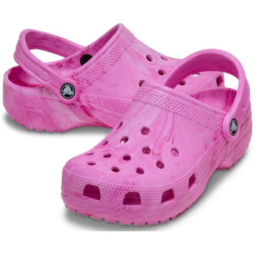Pair of pink women's Crocs with a pink marbled swirly pattern clogs on a white background