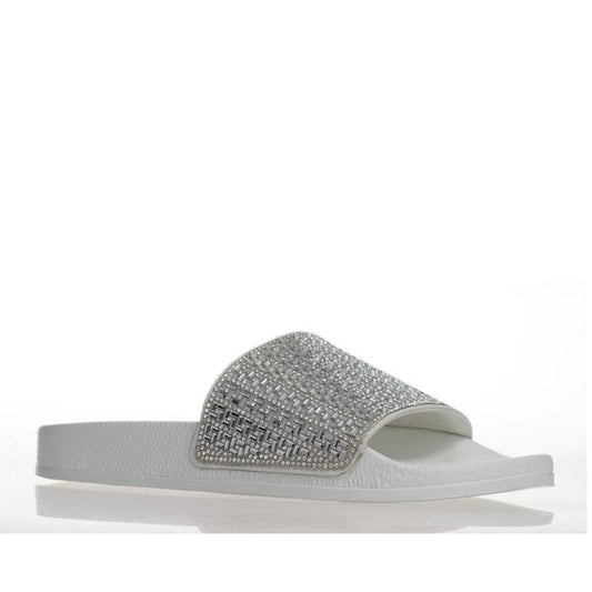 Alfie & Evie Billie Slide: a comfy white sandal with sparkling silver and gray gem strap, easy slip-on, cushioned support shown side view.  ksnz
