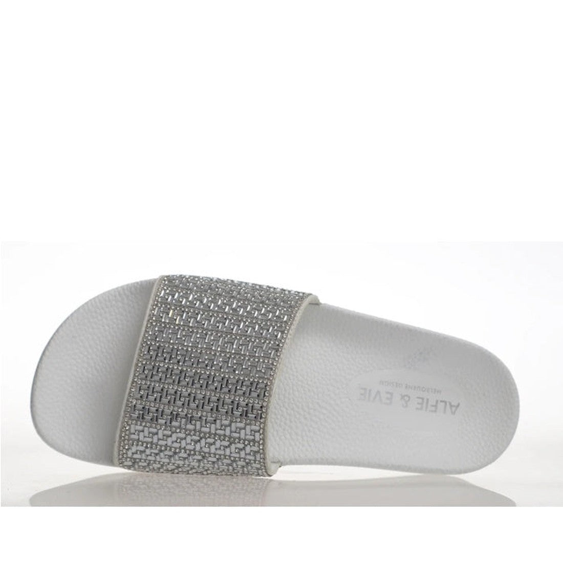Alfie & Evie Billie Slides in white and silver sparkle with a comfy, textured footbed, arch support, and an easy slip-on style.  ksnz, 9353738140649, 9353738140656, 9353738140663, 9353738140670, 9353738140687, 9353738140694