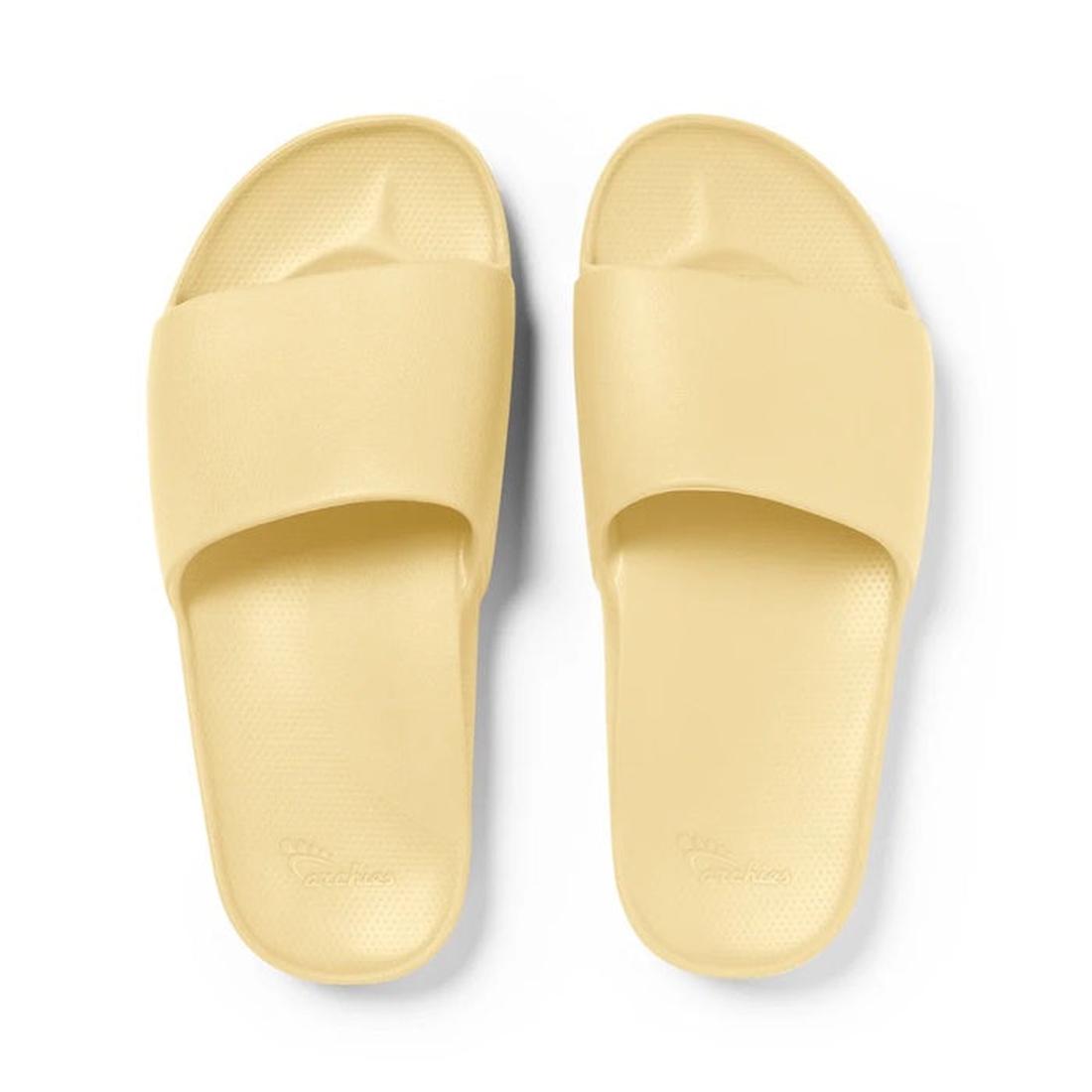 Archies Arch Support Slide Lemon sandals in cheerful yellow, with wide comfy straps and textured soles—easy slip-on style for family comfort.  ksnz