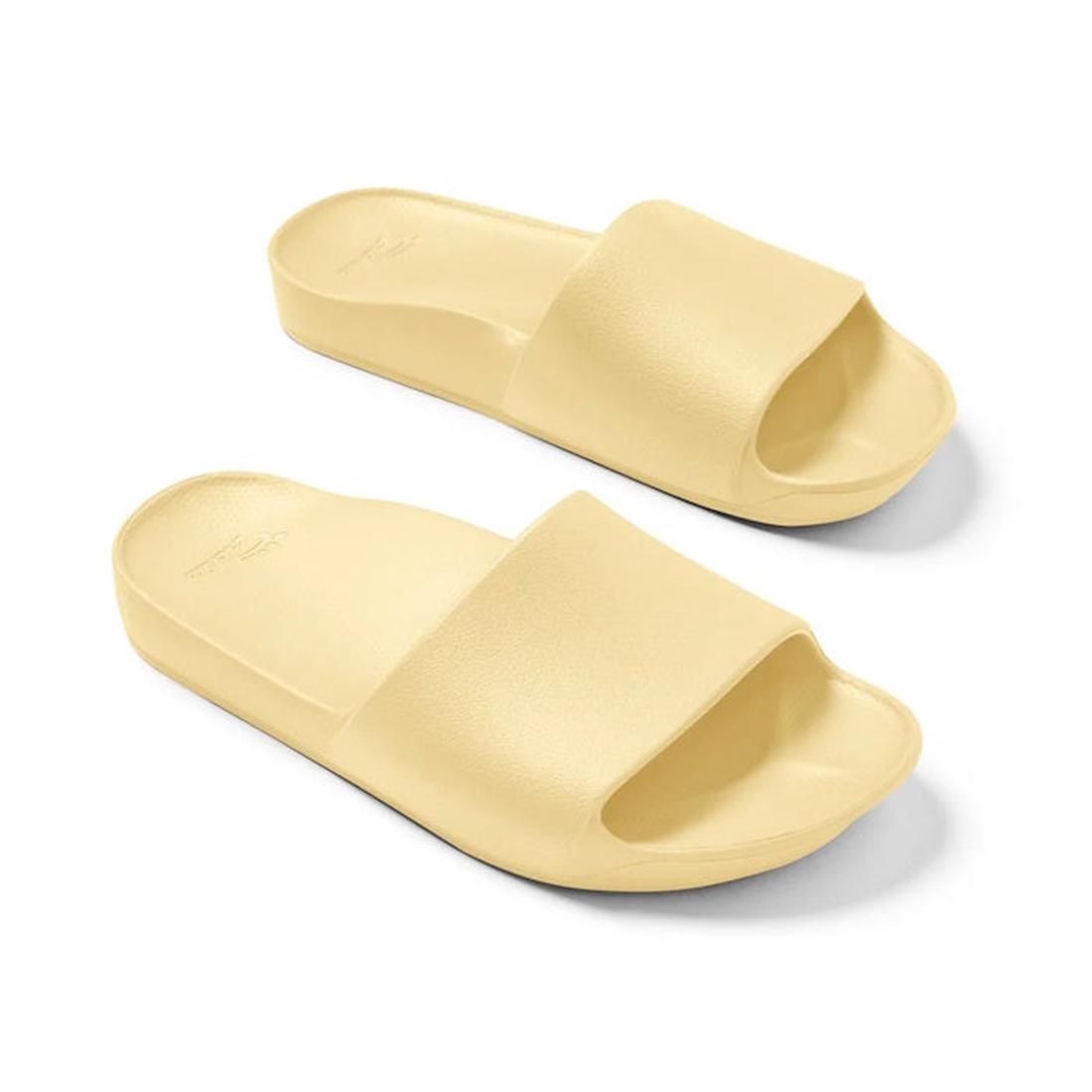 The Archies Footwear Arch Support Slide Lemon is a cheery yellow sandal with comfy thick soles and easy slip-on straps, side by side.  ksnz, 9350311010191, 9350311010207, 9350311010214