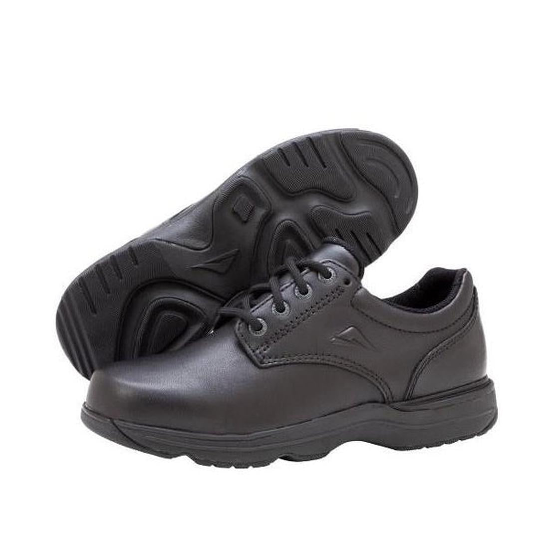 Black leather lace-up youth shoes, one upright and one showing the textured sole.