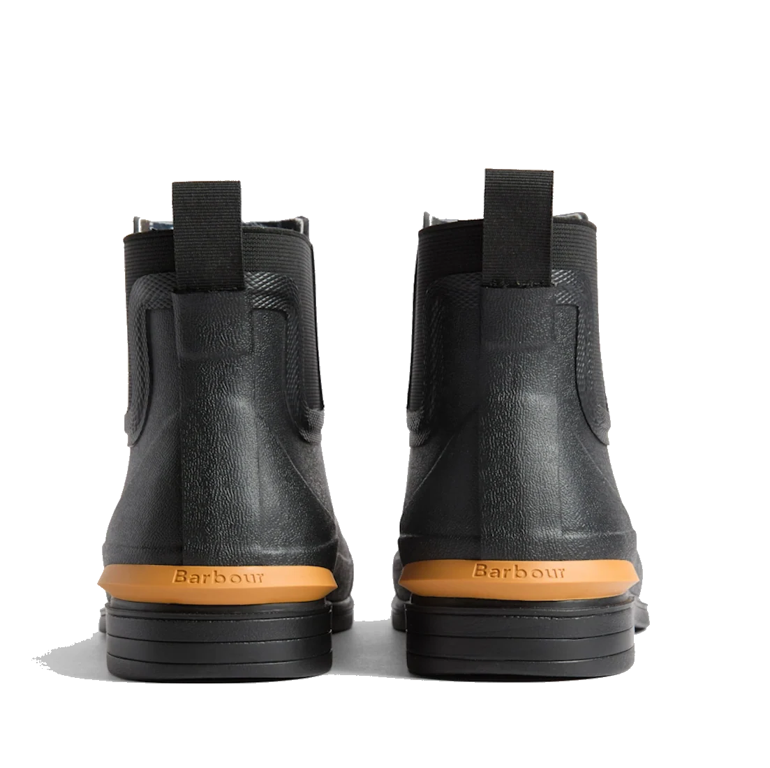 A pair of Barbour Abbeyfield Packable Ankle Wellingtons in black, shown from the back with tan soles, pull tabs, and Barbour branding embossed above the heels—these lightweight ankle wellingtons are ideal as stylish and practical festival boots., 54323, 5