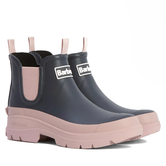 The Barbour Nimbus Dusky Grey/Gardenia Pink Chelsea Wellingtons Womens Rainboot features dusky grey uppers, gardenia pink soles, and elastic side panels for a Chelsea boot-inspired waterproof style, shown on a white background.