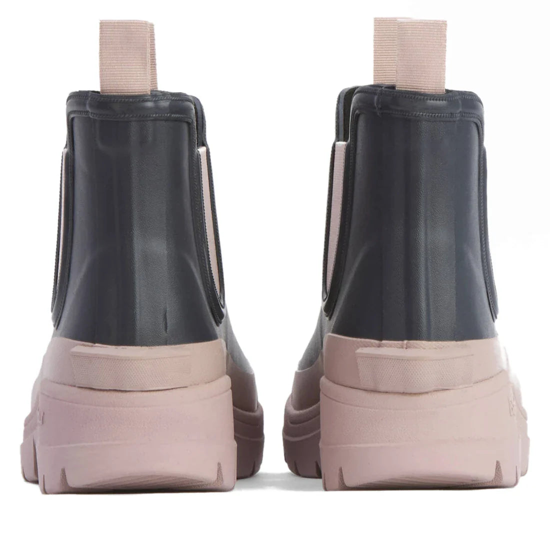 The Barbour Nimbus Dusky Grey/Gardenia Pink Chelsea Wellingtons Womens Rainboot features ankle-height, Chelsea-inspired design with dark gray uppers, thick light pink soles, and matching pull tabs viewed from the back., 5063669171677, 5063669171684, 50636