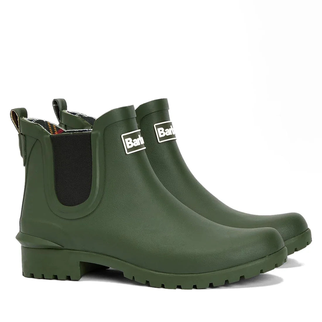 The Barbour Wilton Olive Chelsea Wellingtons Womens Rainboot features black elastic side panels, a front Barbour logo, rugged sole, back pull tab, and signature Barbour tartan lining for style and comfort.
