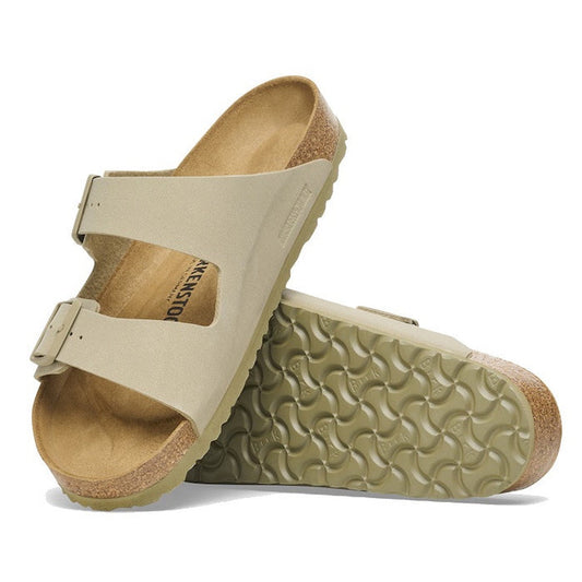 a pair of Birkenstock Arizona Birko Flor Faded Khaki Regular Width with double straps, one over the foot and one over the toes with buckle adjustment. Staps are linked at the sides of the foot. Synthetic straps and a suede leather footbed,