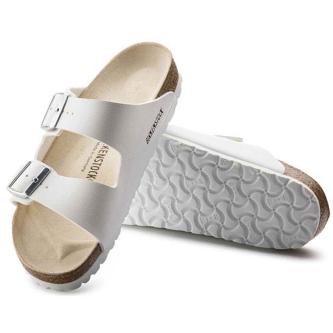 a pair of Birkenstock Arizona Birko Flor White Light Sole Regular Width with double straps, one over the foot and one over the toes with buckle adjustment. Staps are linked at the sides of the foot. Synthetic straps and a suede leather footbed,