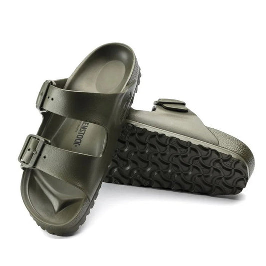 a pair of Birkenstock Arizona EVA Khaki Regular Width with double straps, one over the foot and one over the toes with buckle adjustment. Staps are linked at the sides of the foot. Made of EVA a plastic like material, suitable fot being around water