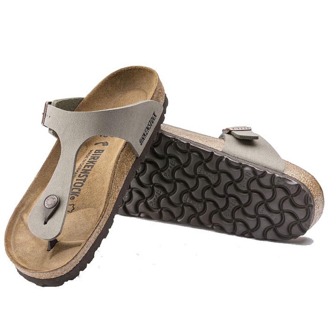 A pair of Birkenstock Gizeh BirkiBuc Stone Grey Regular Width sandals; one shows the contoured footbed, while the other is propped up to display the textured black sole.