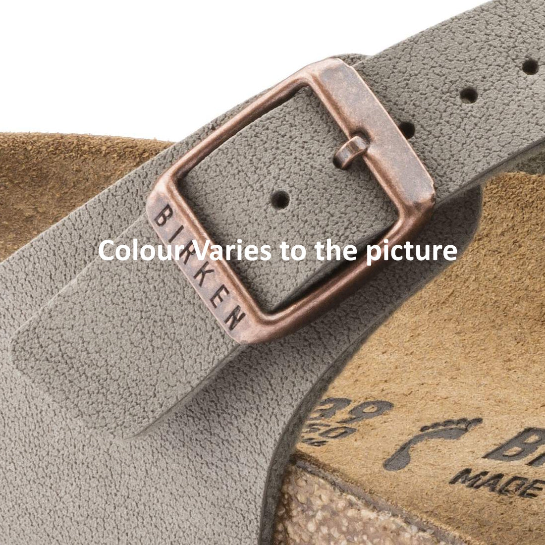 Close-up of a Birkenstock Gizeh BirkiBuc Stone Grey Regular Width sandal buckle and gray strap with “BIRKEN” engraved. Part of the contoured cork footbed is visible. Text reads, “Colour/Varies to the picture.”., 48753, 48754, 4013871810414, 4013871810421,