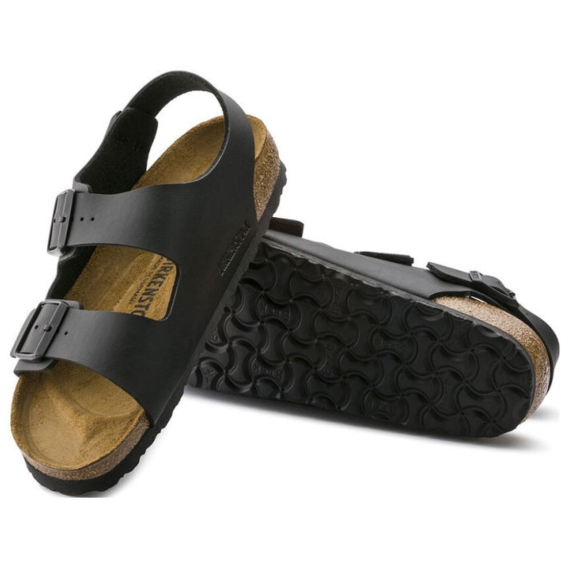 The Birkenstock Milano Birko Flor Black Narrow Width sandals feature cork footbeds and adjustable buckle straps; shown upright and on their side to display the textured sole, they are perfect for those seeking a narrow fit.