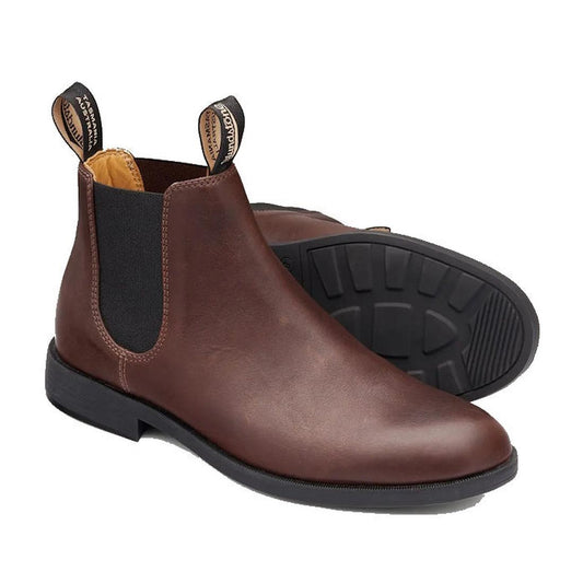 a pair of b.lundstone 1900 dress boots in brown, one foot showing top and side view, one foot showing part of the sole