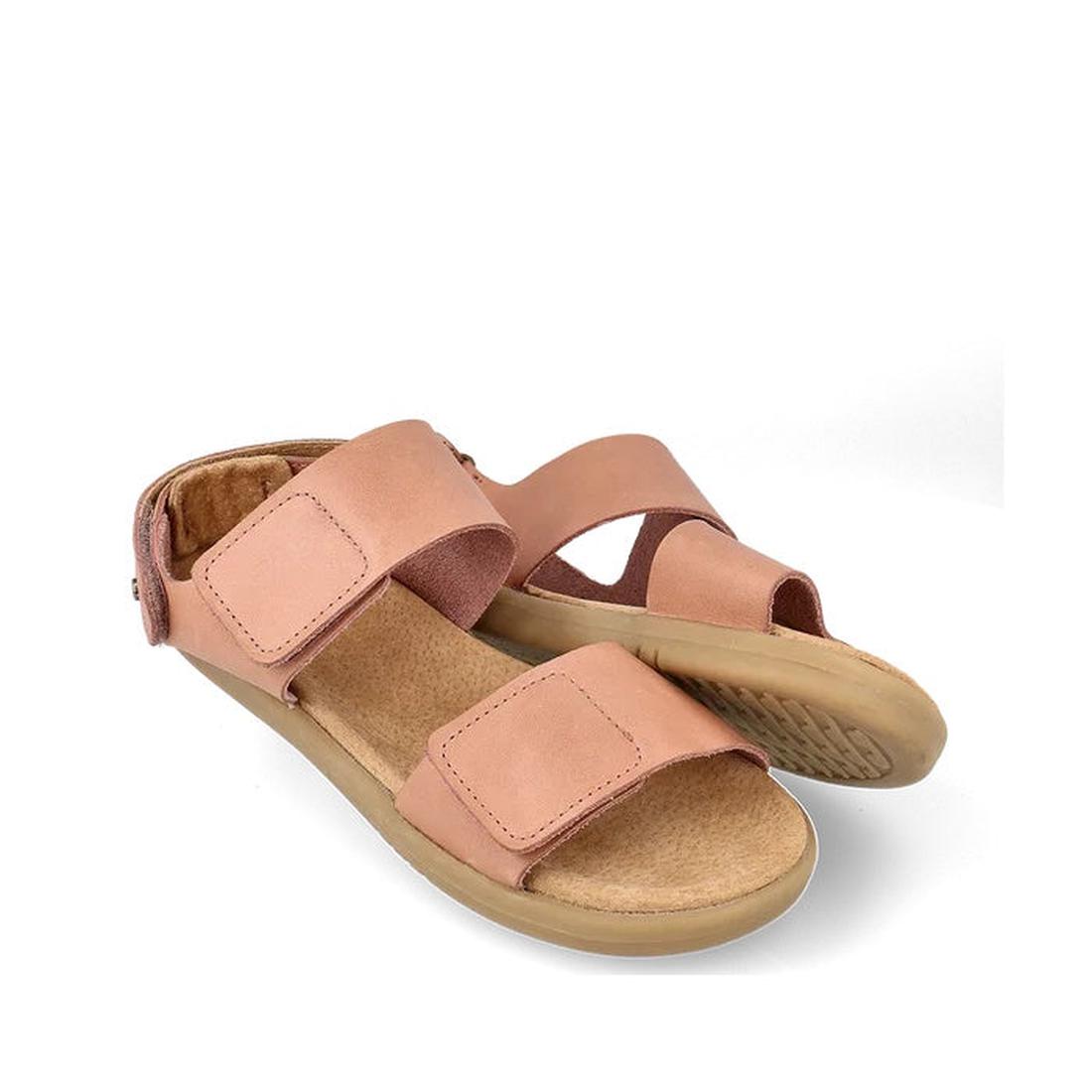The Bobux Kid+ Plus Italian Clay Coast Open Toe Sandal 851201 is a pair of tan, breathable sandals with adjustable hook-and-loop straps and flat rubber soles, shown against a white background.