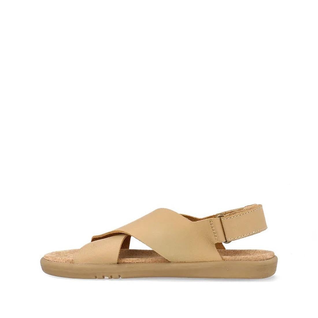 The Bobux Kid+ Plus Glide Parchment Beige Open Toe Sandal features crisscross leather straps, an adjustable hook-and-loop heel strap, and a flat cushioned sole for kids., 9420075773110, 9420075779952, 9420075774957, 9420075773387, 9420075773660, 942007577