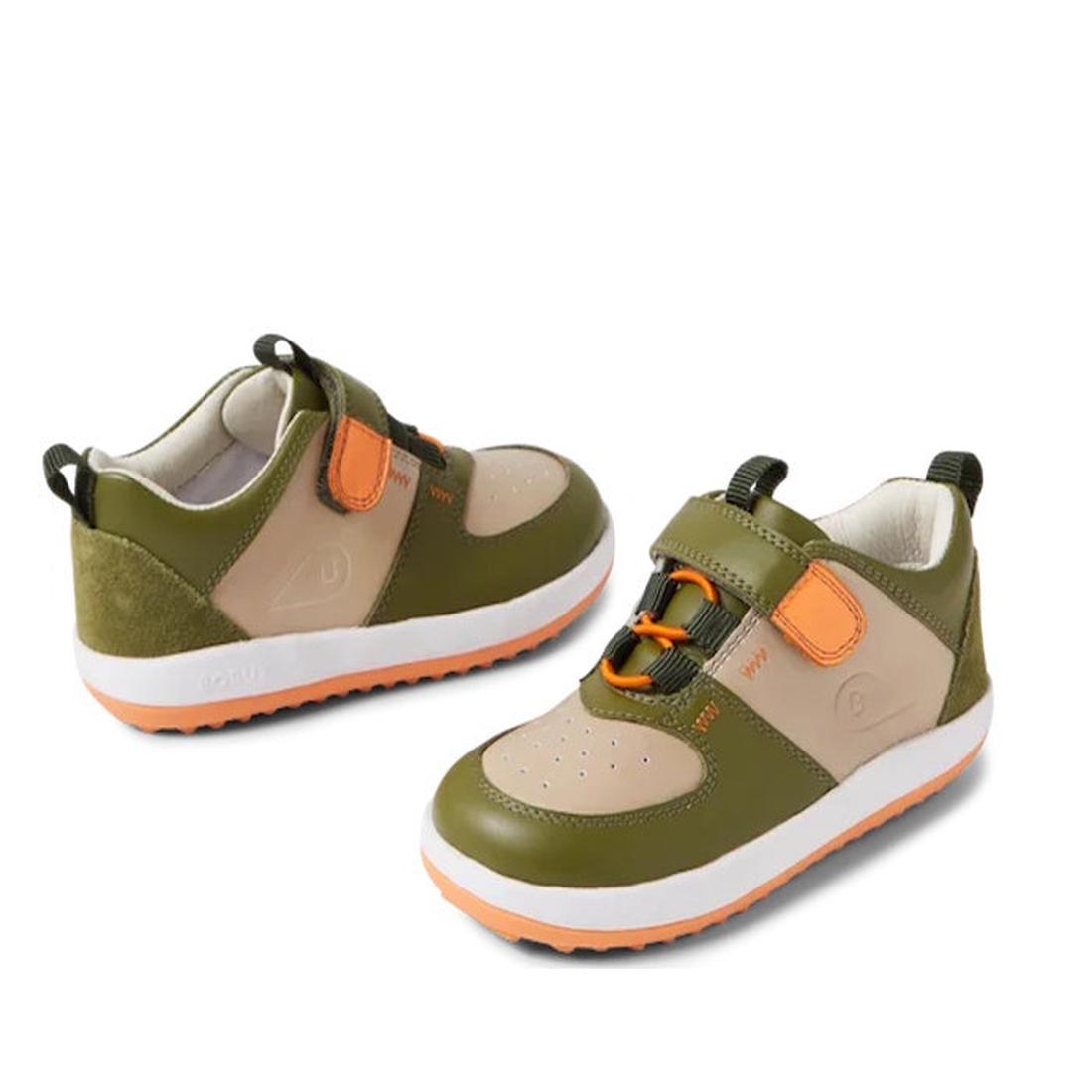 The Bobux Kid+ BackSpin Leather Mid Boot Sneaker 853001 in Sea Kelp Green features olive, beige, and orange leather, orange elastic laces, a hook-and-loop strap, pull tab heel, white soles, and a lightweight EVA midsole for comfort.