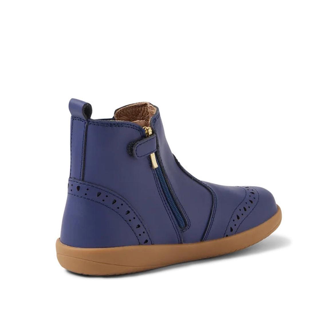 The Bobux Kid+ Billie Leather Boot in Future Dusk Blue/Purple (852002) is a kids' leather boot with a tan rubber sole, decorative perforations, and a comfy side zipper, shown at an angle on a white background., 9420068543911,
9420068543928,
9420068543935,