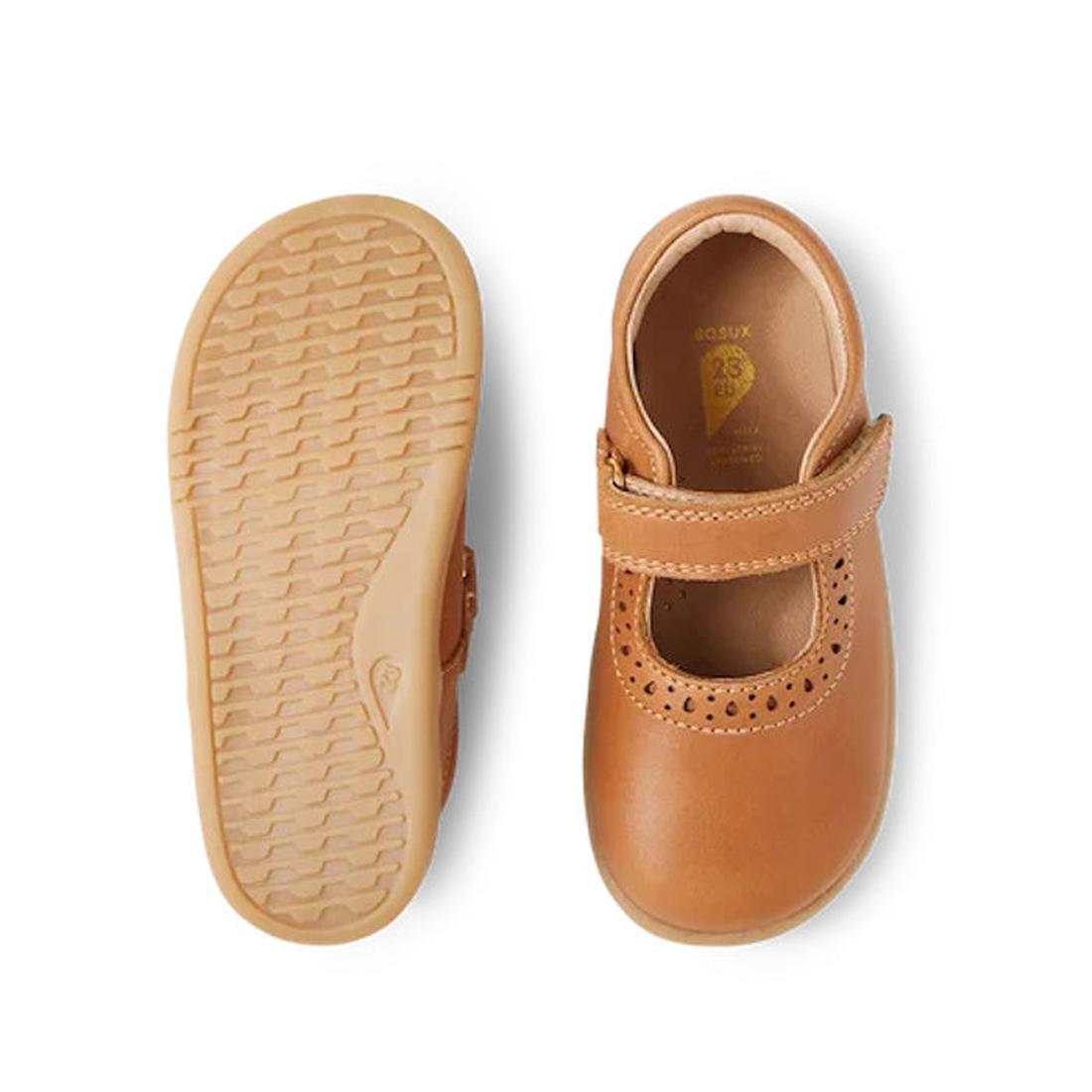 A pair of Bobux Iwalk Lola Toddlers Mary Jane Caramel Tan Leather shoes, one shown from the top with a T-bar strap, the other from below displaying the flexible, textured sole for comfort and grip., 9420068549531, 9420068549548, 9420068549555, 94200685495