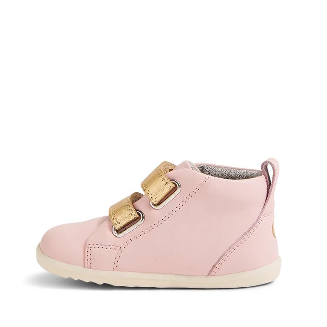 The Bobux Step Up SU Hi Court Boot Ballet Pink 750818 is a single kids' pink leather sneaker with two gold hook-and-loop straps, a white sole, and a small heel pull tab, shown on a white background., 42959, 9420068540583, 9420068540590, 9420068540606