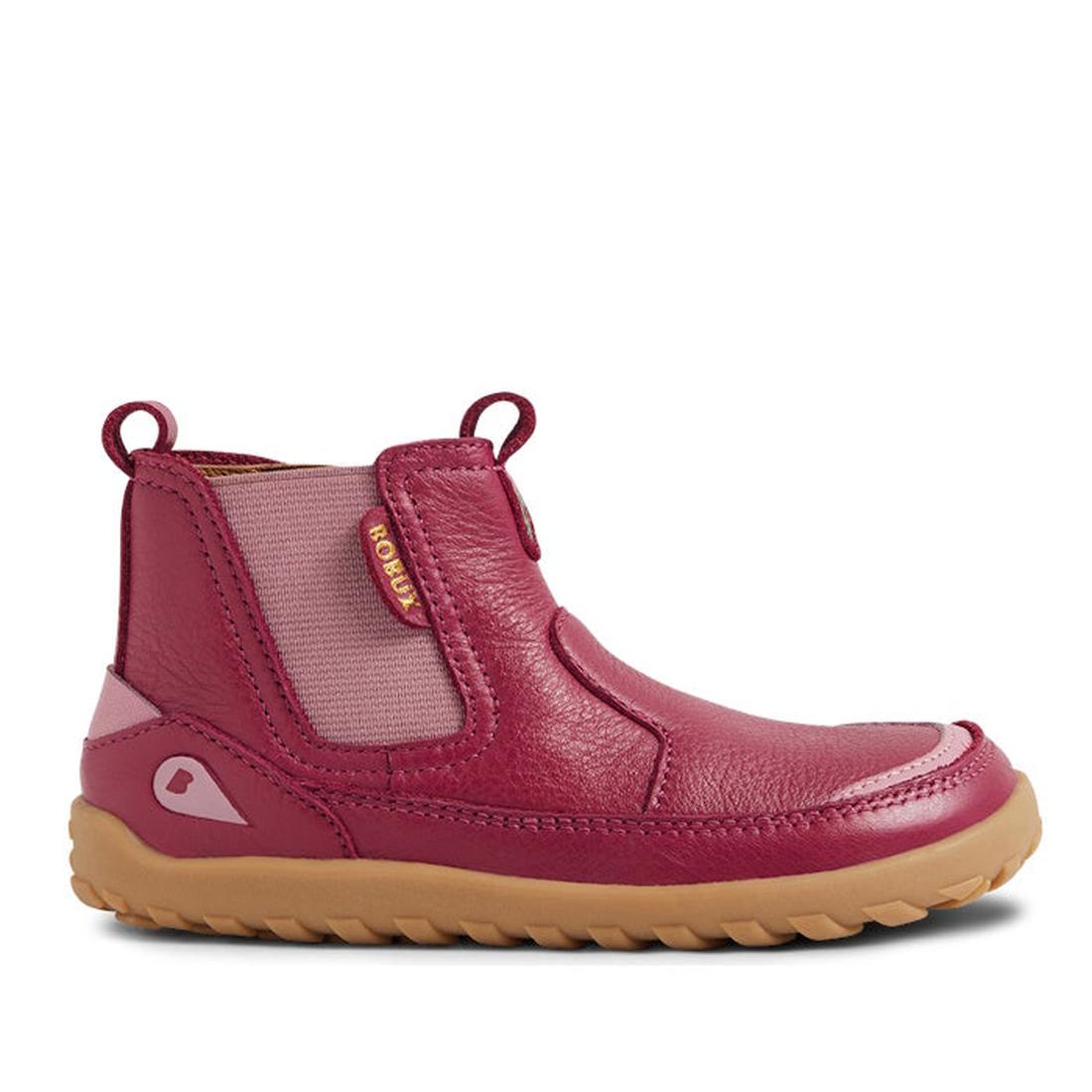 The Bobux IW Iwalk Trail Leather Boot Beaujolias Purple Alpha is an ankle-high kids' leather boot in pink and maroon, featuring elastic side panels, a back loop, tan rubber sole, textured finish, barefoot-shaped toe-box, and a BOBUX tag., 9420068563667, 9