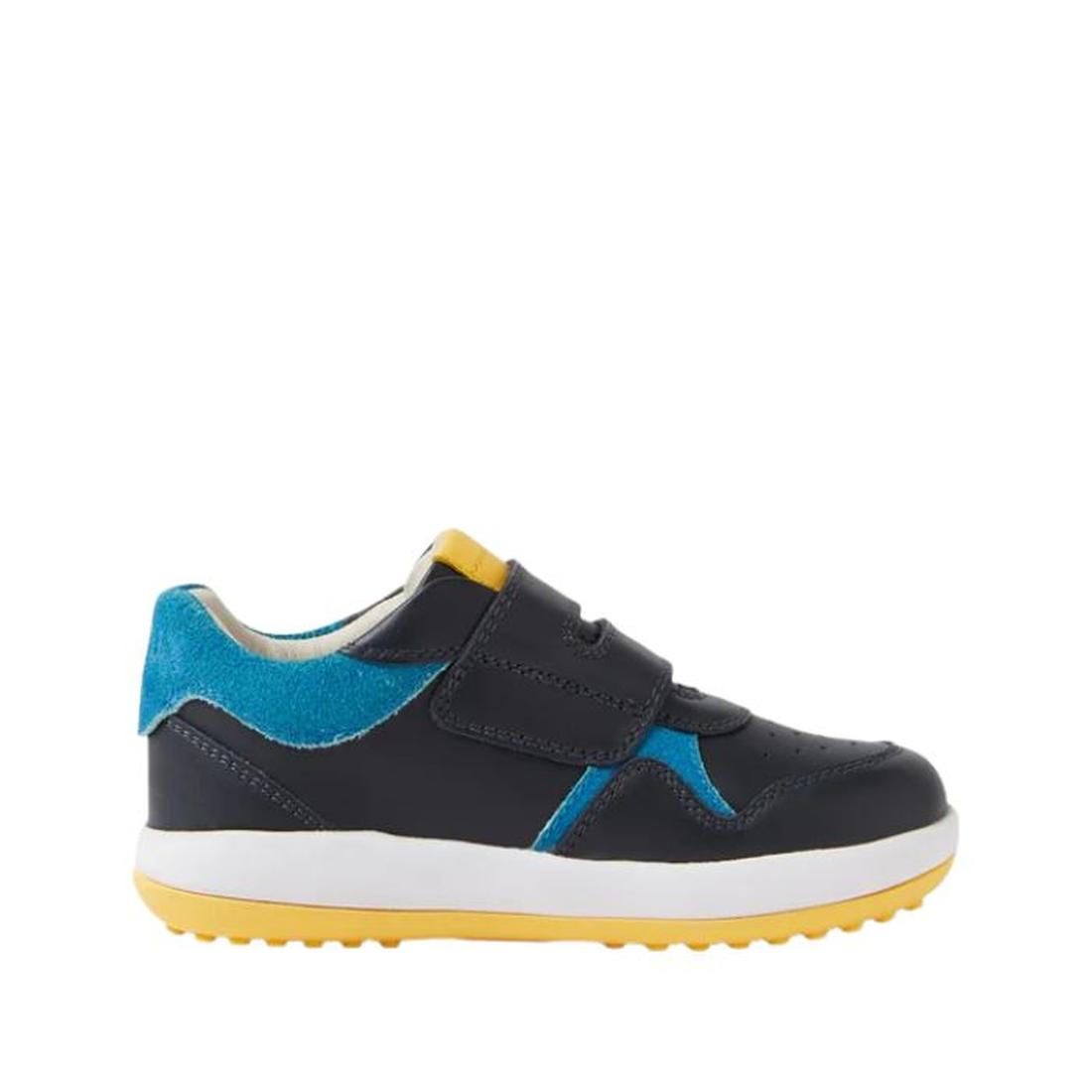 The Bobux IW Iwalk Baseline Leather Mid Sneaker Navy is a kids' leather sneaker featuring a dark navy and bright blue upper, yellow heel detail, white midsole, yellow treaded sole, hook and loop strap for easy wear, and stylish stitching accents., 9420074