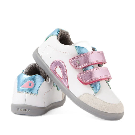 Two white Bobux IW Iwalk Blaze Toddlers Leather Sneakers in Pink Metallic feature gray soles, blue and pink metallic accents, and double pink Velcro straps. One shoe stands upright while the other leans against it, displaying the BOBUX branding on the hee