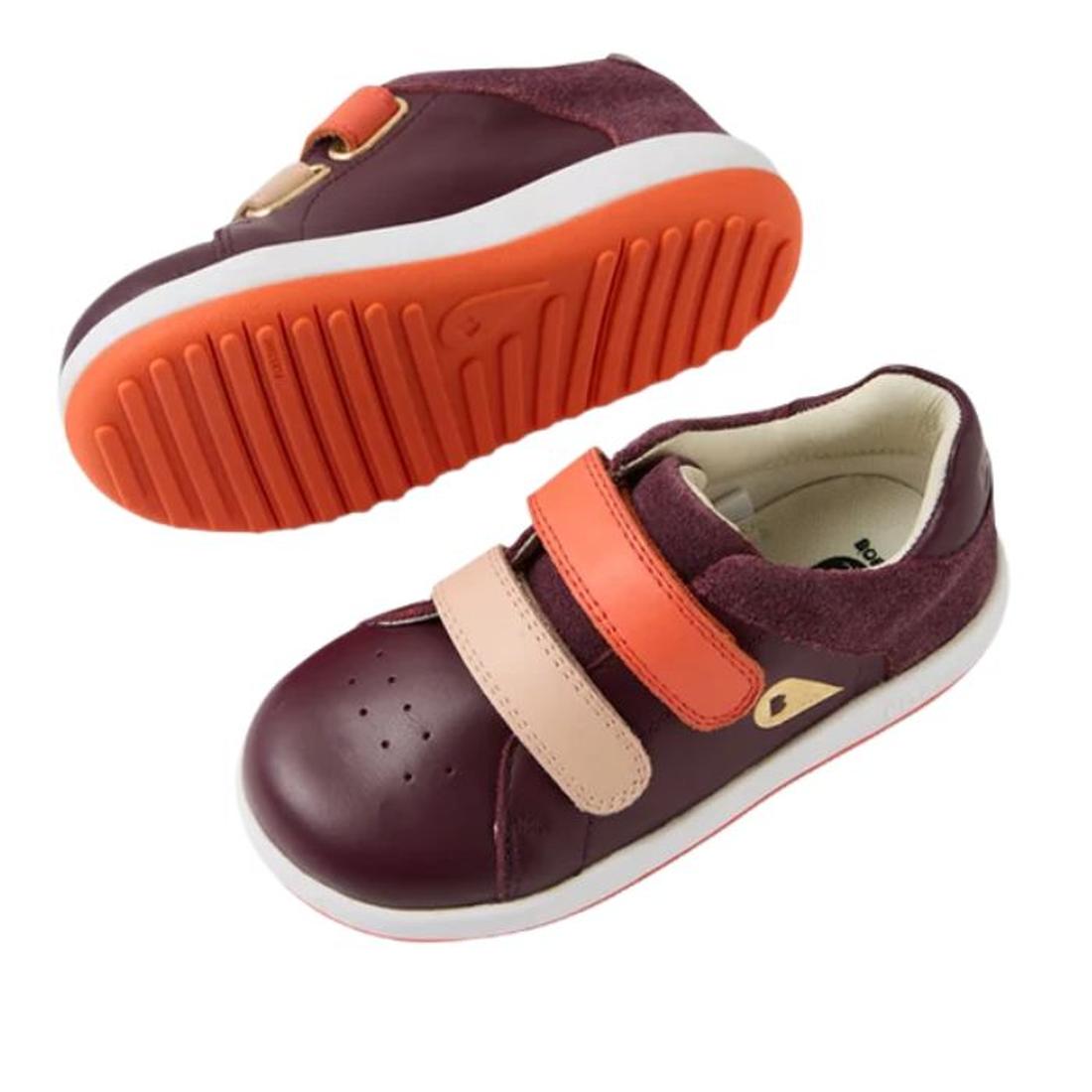 Bobux IW Iwalk Breakpoint Leather Fig Purple kids' sneakers feature maroon and pink leather uppers, an orange strap, and a white-orange sole. One shoe is upright showing the top/side; the other is flipped to reveal its textured sole., 9420074817600, 94200