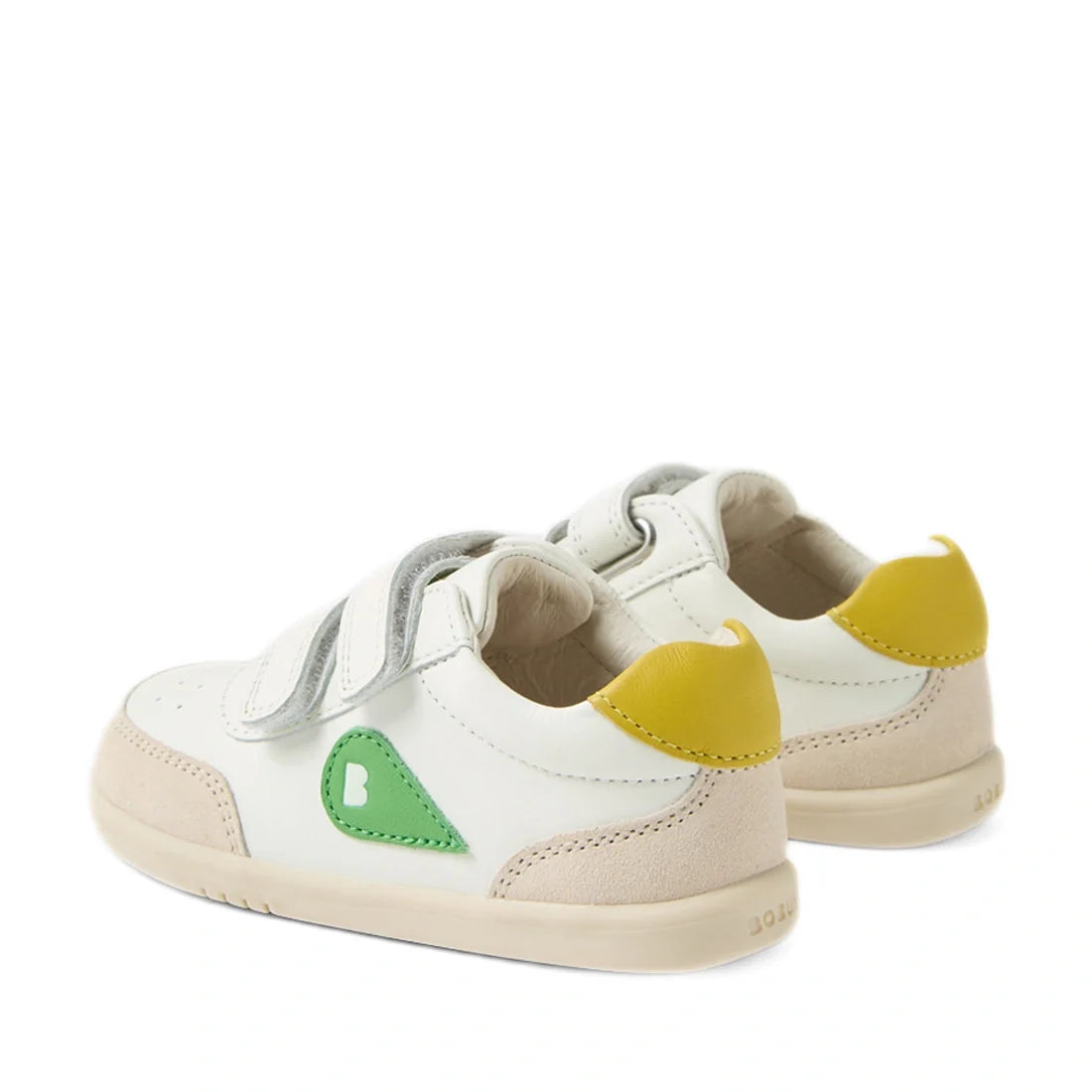 Two pairs of Bobux IW Iwalk Toddlers Champ Leather Sneakers in white and green, featuring beige soles, green side details, yellow heel accents, and double hook-and-loop straps, are positioned at an angle on a white background., 9420074856609, 942007485661