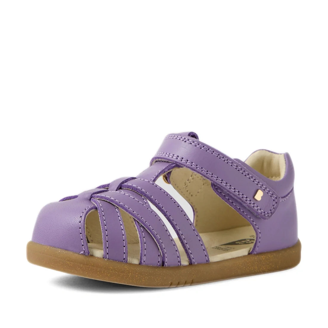 The Bobux Iwalk IW Cross Jump Toddlers Purple Haze Leather Sandal is a single children’s sandal in purple, featuring a closed toe, strappy design, adjustable Velcro strap, and a brown rubber sole, displayed against a white background., 9420074808714, 9420