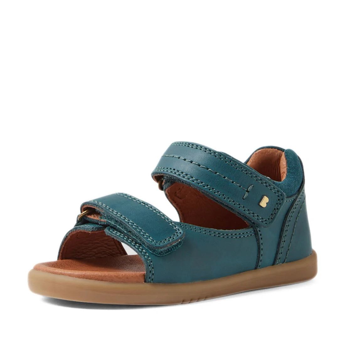 The Bobux IWalk Driftwood Sandal in Mediterranean Green is a children’s sandal featuring two adjustable Velcro straps, an open toe for breathability, a brown cushioned sole, and a closed heel—making it a stylish choice for toddler boys’ leather sandals—di