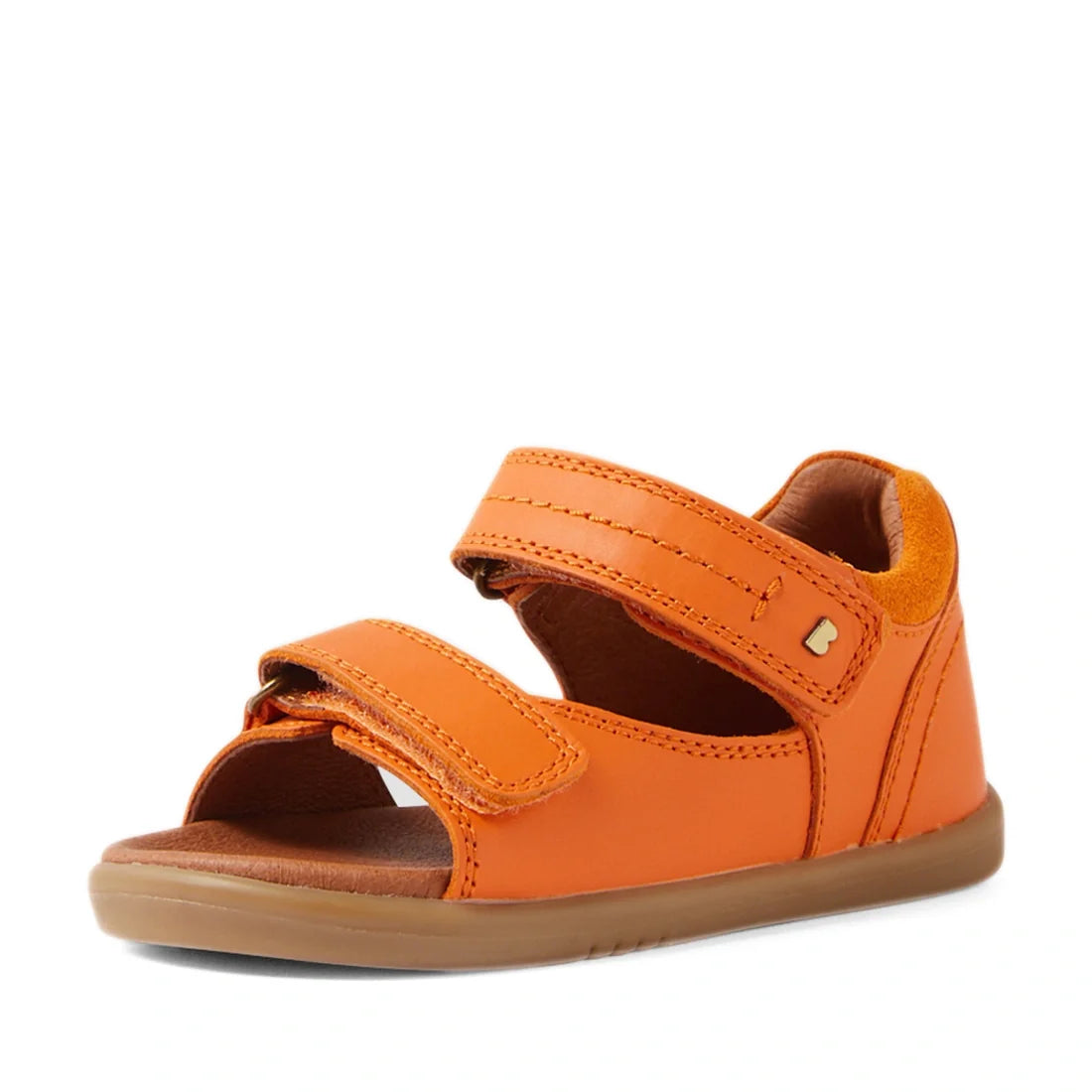 The Bobux IWalk Driftwood Sandal in Orange Peel is a toddler boys’ leather sandal featuring two adjustable Velcro straps and a brown rubber sole. Inspired by the classic Driftwood style, this open-toe sandal offers comfort and breathability, and is displa