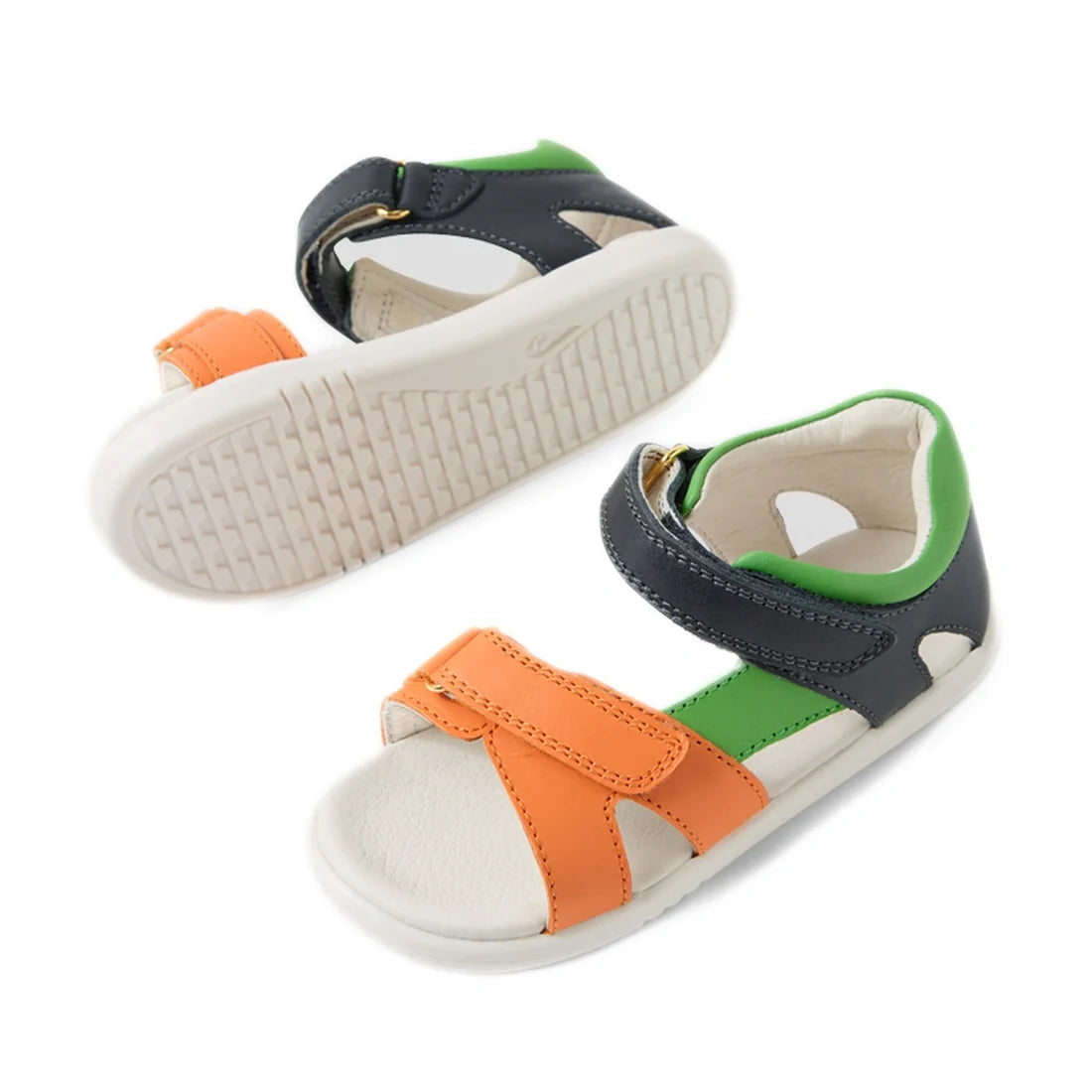 The Bobux IWalk Dune Toddlers Sandal Navy Open Toe features orange, green, and navy blue straps with white soles and Velcro closures, offering both style and comfort. These adjustable toddler sandals are displayed from the top and bottom to clearly showca