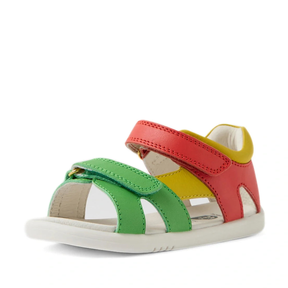 The Bobux IWalk Dune Toddlers Sandal in Grenadine Red features green, yellow, and red adjustable straps, an open toe design, a white sole, and a Velcro closure—making it the perfect adventure-ready sandal for little explorers., 9420074855091, 942007485510