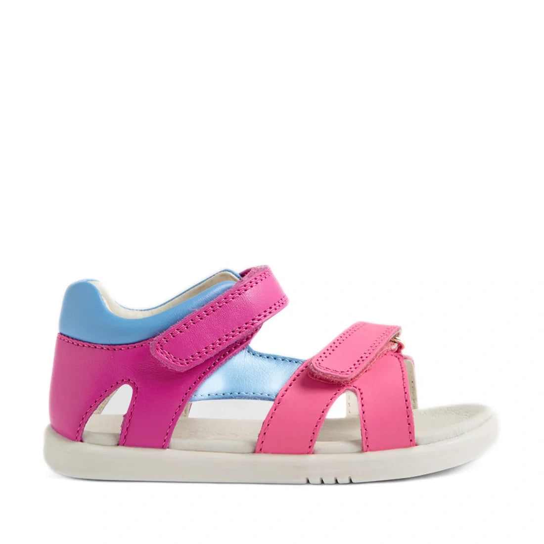 The Bobux IWalk Dune Toddlers Sandal in Rose Violet Bright Pink is a charming pair of open-toe leather sandals featuring pink straps, a contrasting blue heel section, and two adjustable Velcro closures. With a sturdy white sole and designed for breathabil