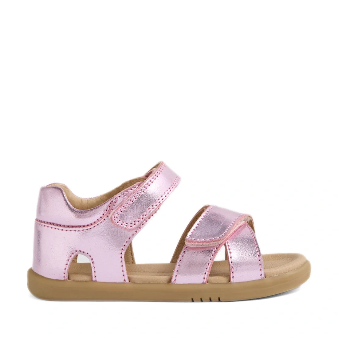 The Bobux IWalk Flora Toddlers Sandal in Pink Lemonade is a shiny metallic pink open-toe sandal for children, featuring two adjustable straps and a tan rubber sole. Shown on a white background, these breathable leather sandals offer toddlers both comfort 