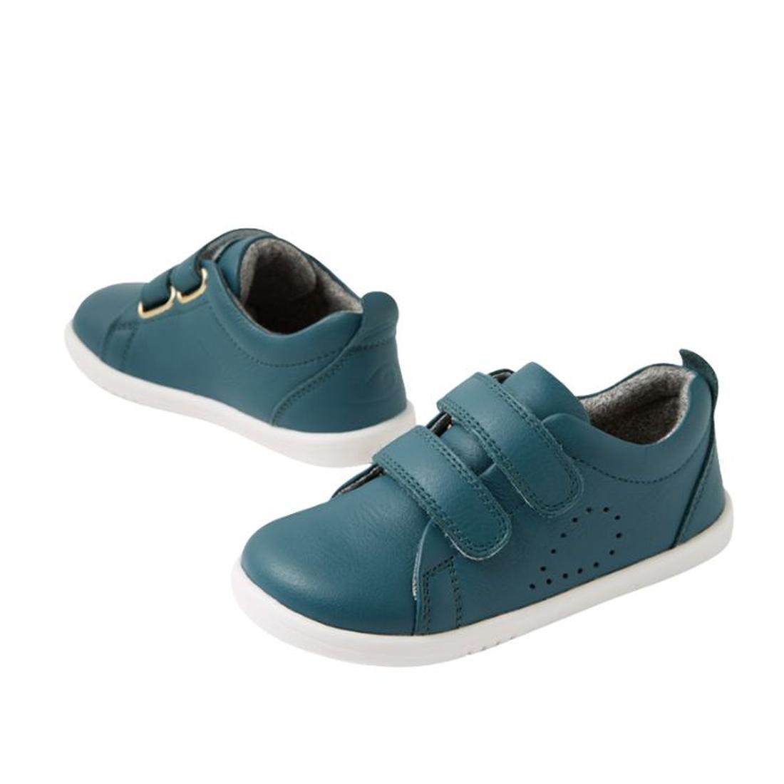 The Bobux IW Iwalk Grass Court Leather Sneaker in Mediterranean Green is a toddler shoe with white soles, Velcro straps, and side perforations, featuring a street-style trainer design, shown on a white background., 9420074806734, 9420074806741, 9420074806