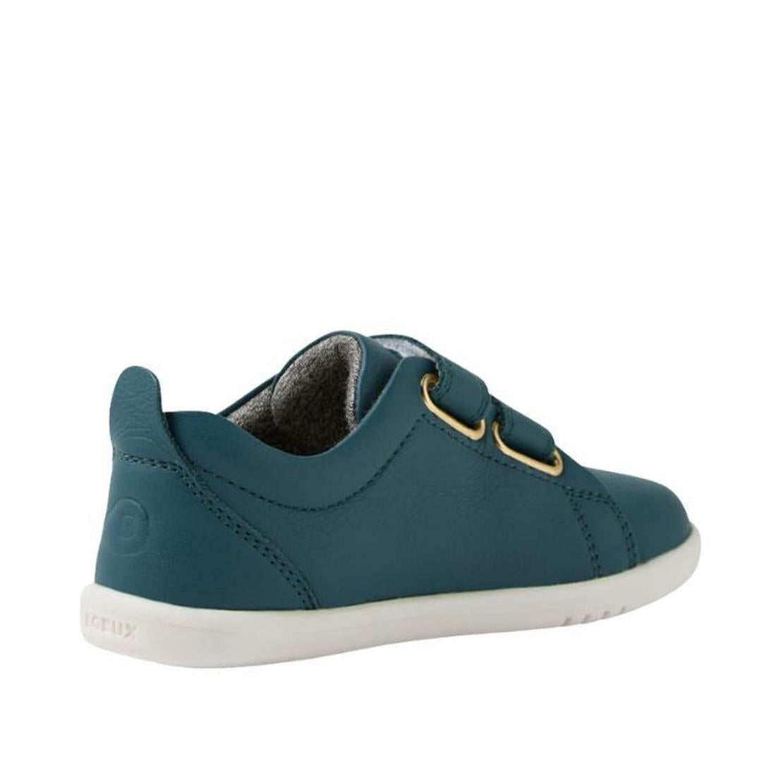 The Bobux IW Iwalk Grass Court Leather Sneaker in Mediterranean Green features a premium leather upper, white sole, dual velcro straps, gold eyelets, visible stitching, and gray interior lining. Shown from the back left side., 9420074806734, 9420074806741