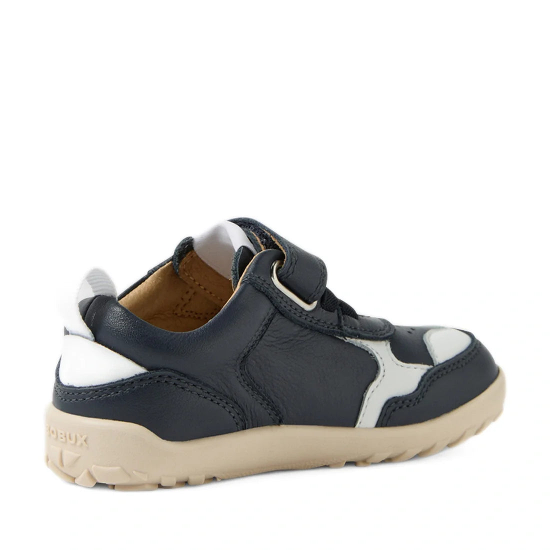 The Bobux IW Iwalk Neo Toddlers Leather Sneaker Navy Barefoot features premium navy blue and white leather with a beige sole, a Velcro strap, and a zero drop design to support natural foot development. Displayed at an angle from the back left side., 94200