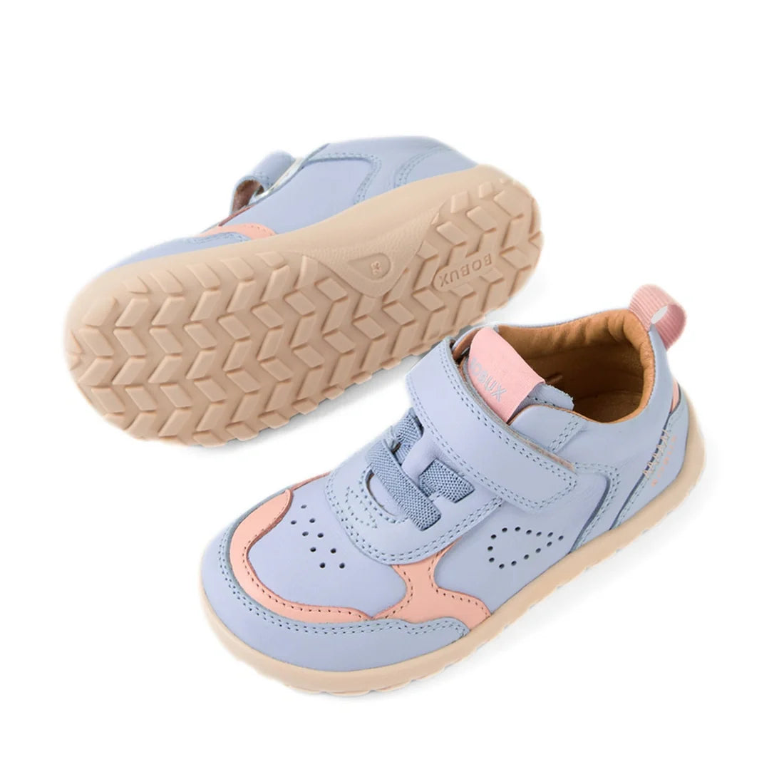 The Bobux IW Iwalk Neo Toddlers Leather Sneaker Skyway Blue Barefoot is shown here in pastel blue and pink with beige soles, designed in a barefoot shoe style with a zero-drop sole. One sneaker is pictured from the side and one from the bottom, showcasing