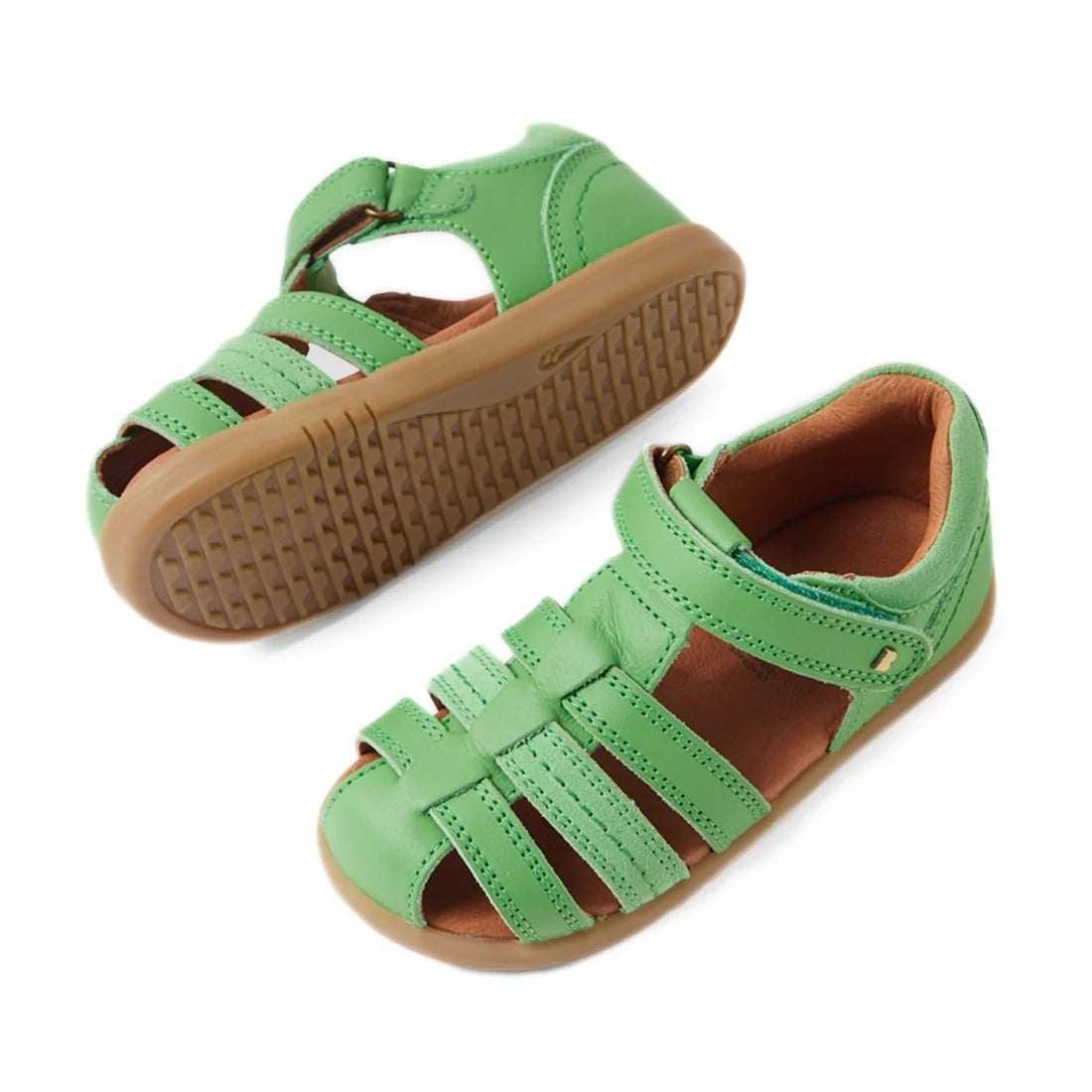 A pair of Bobux IWalk Roam Sandal Retro Green Closed Toe Toddlers, featuring a woven leather design, closed toes, brown rubber soles, and adjustable ankle straps, displayed on a white background—perfect summer shoes for kids., 9420074807335, 9420074807342