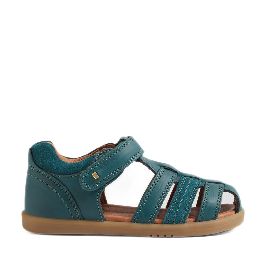The Bobux IWalk Roam Sandal in Mediterranean Green for toddlers features a closed toe, multiple straps, and a secure hook-and-loop closure. Designed for comfort and style, these sandals have a durable brown sole and are displayed in side profile on a whit