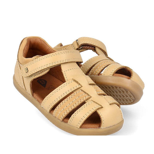 a pair of Bobux IWalk Roam Sandal Parchment Beige Closed Toe 626030- closed toe sandals with closed back for heel support. velcro around the heel and straps of leather over the toes so air can move freely around the toes.