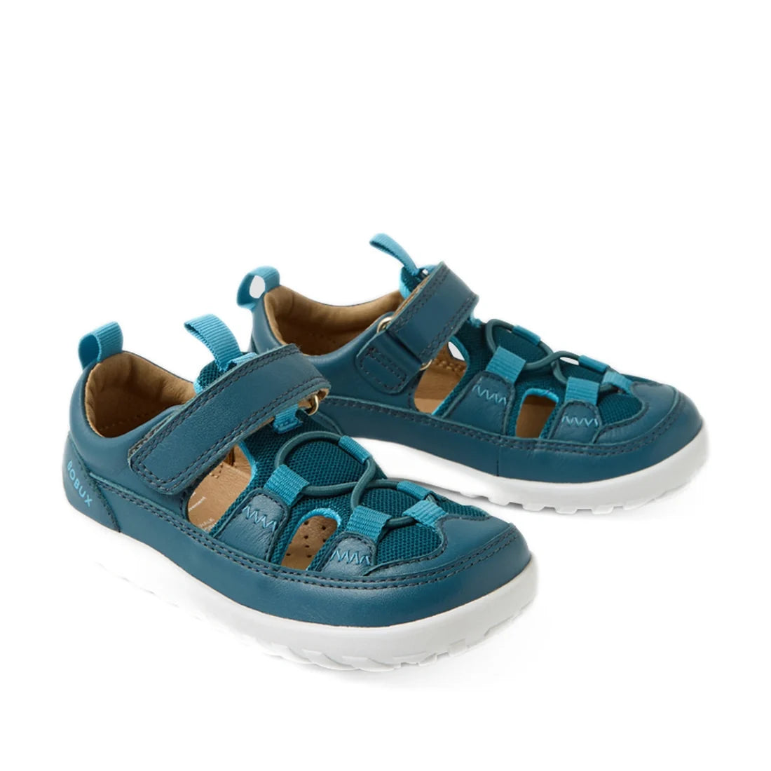 A pair of Bobux IW Iwalk Rocky Mediterranean Green Closed Toe Sandals for kids, featuring leather construction with velcro straps, mesh and leather details, and white rubber soles, displayed on a white background.